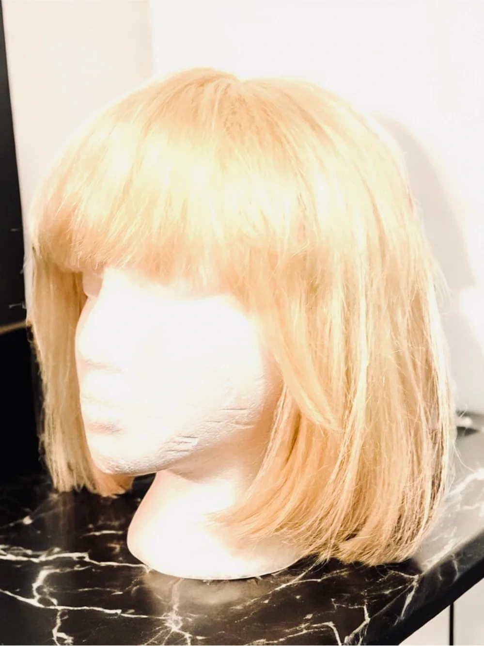 Platinum Blonde Bob Wig with a Straight Cut and Classic Fringe Bangs